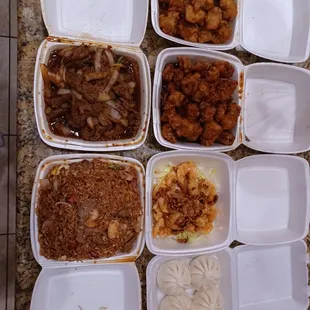 a variety of chinese food in containers