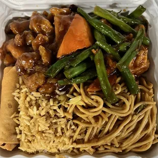 a takeout container with noodles and vegetables