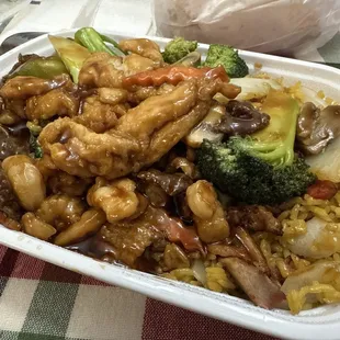 Chicken, shrimp, and beef over vegetables