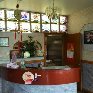 Small counter with two small tables. Almost all of their business is take-out.