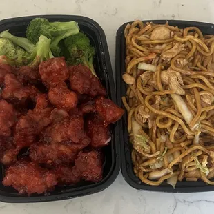 two takeout containers of chicken, broccoli and noodles
