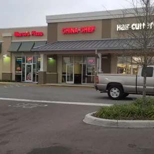 a stop sign in front of a chinese restaurant