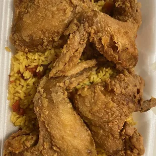 fried chicken and rice in a styrofoam container