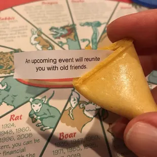 a fortune card with a fortune wheel in the background