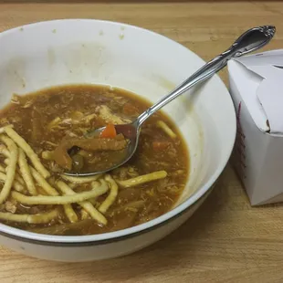 Hot and sour soup with peas, carrots, and wontons - the fried noodles like with chow mein, not fried wonton strips