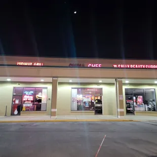 the front of a restaurant at night