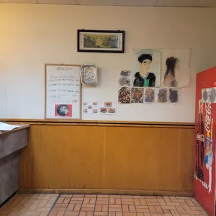 a restaurant counter with a vending machine