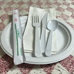 fork, spoon, and spoon rest on a plate