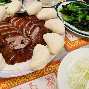 Peking duck with steam buns and Chinese broccoli