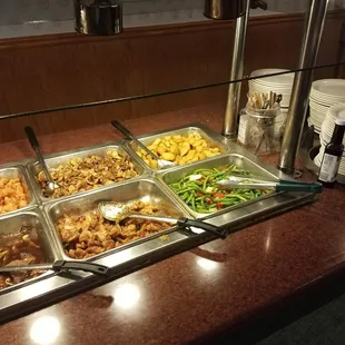 a buffet with a variety of food items