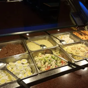 a buffet with a variety of food items