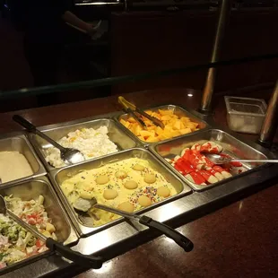 a buffet with a variety of food items
