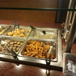 a buffet with a variety of food items