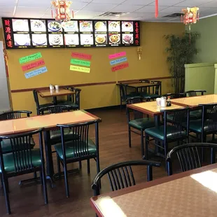 a restaurant with tables and chairs