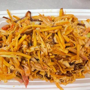 a plate of chinese food in a styrofoam container