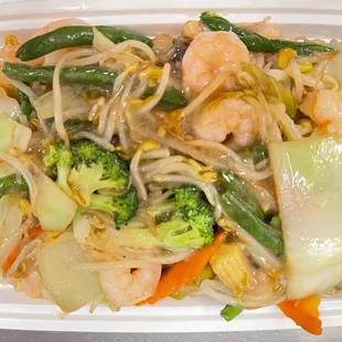 shrimp, broccoli, and noodles in a styrofoam container