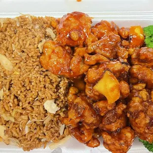 a takeout container with rice, broccoli, and chicken