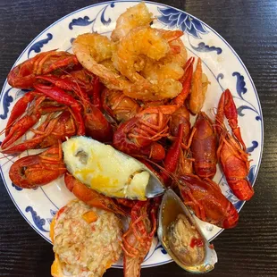 a plate of lobsters, clams, and other seafood