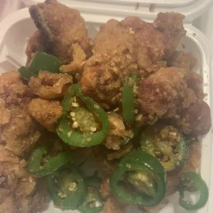 Salt &amp; Pepper chicken. Garlicky, salty, crispy! The jalapeños add a nice kick.  They also make this boneless.