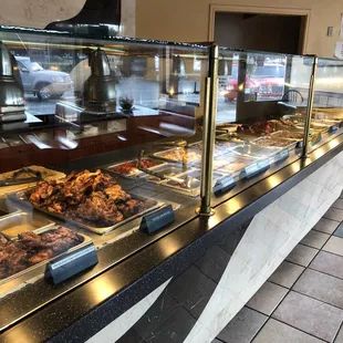 a variety of food in a buffet