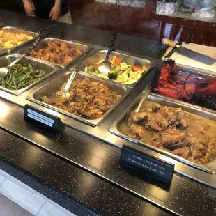 a variety of food in a buffet