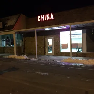 the front of a chinese restaurant at night