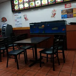 a restaurant with tables and chairs