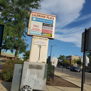 a sign on a corner of a city street
