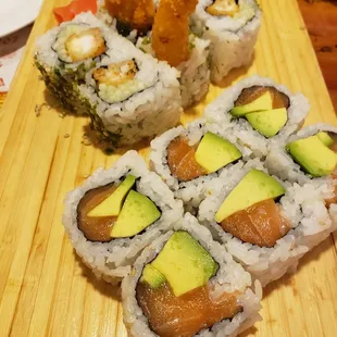 a plate of sushi and avocado