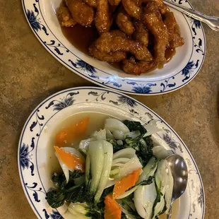 two plates of chinese food