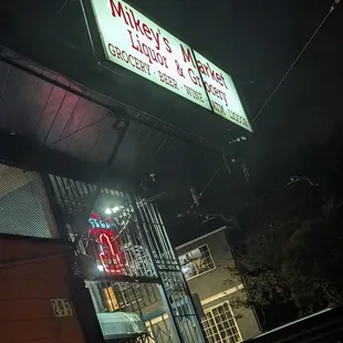 This is the lit sign for the liquor store, note that there&apos;s no sign for China Delight, but the restaurant is to the left of this store