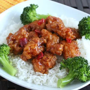 a plate of rice and broccoli