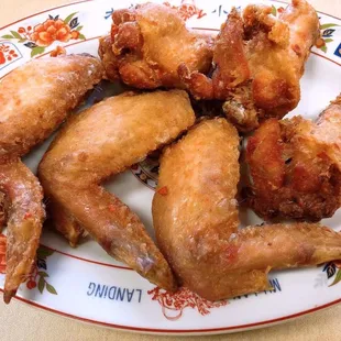 a plate of fried chicken wings