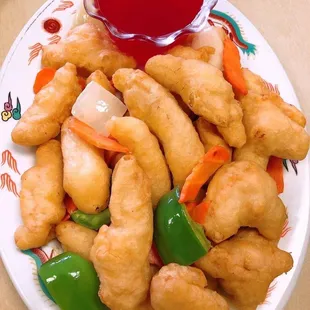 a plate of chinese food with sauce