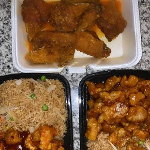 three takeout containers of food