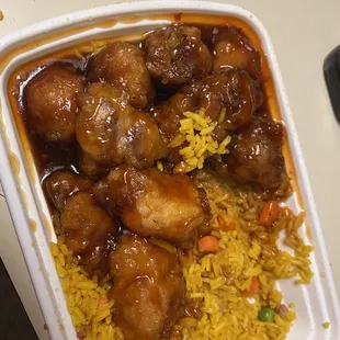chicken and rice in a styrofoam container
