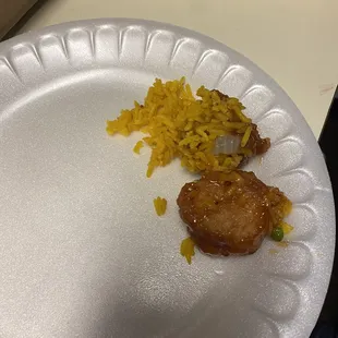 a plate of food with rice and meat