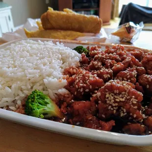 Sesame chicken combo plate, (comes with white or fried rice and an egg roll.)