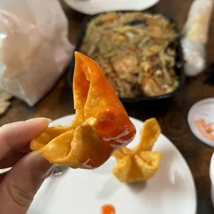 Signature Krab Rangoon in dipping sauce.