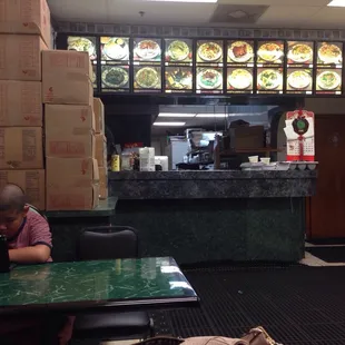 a man sitting at a table in a restaurant