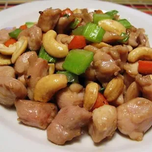 a plate of cashews and vegetables