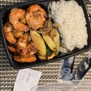 hibachi shrimp with white rice, mushrooms, zucchini, and onions.