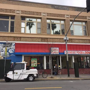 a car parked in front of a chinese restaurant