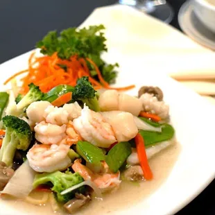 a plate of seafood and vegetables