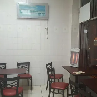 a dining area with tables and chairs