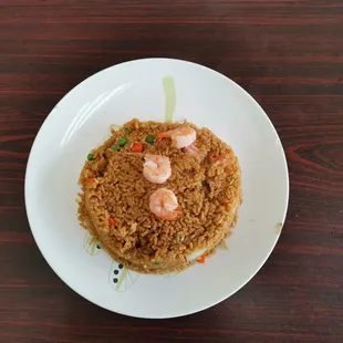 a plate of fried rice with shrimp