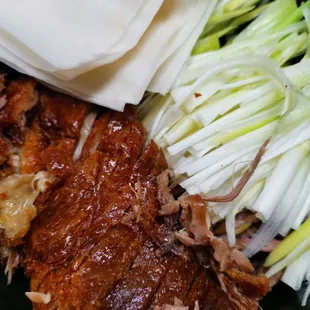 a plate of meat and vegetables