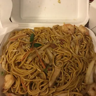 a take out box of noodles