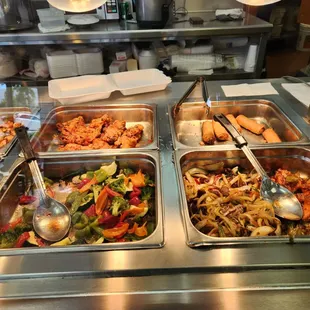 a variety of food items in a buffet