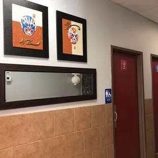 a hallway with two red doors